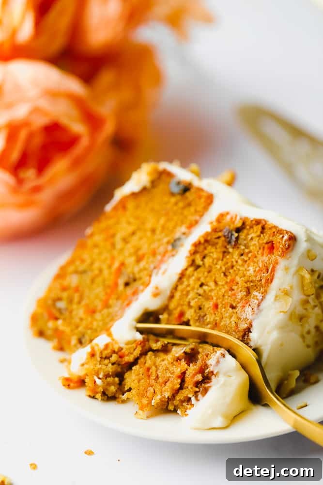 a fork about to take a bite of orange cake