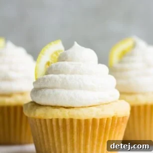 straight on photo of 3 vegan lemon cupcakes