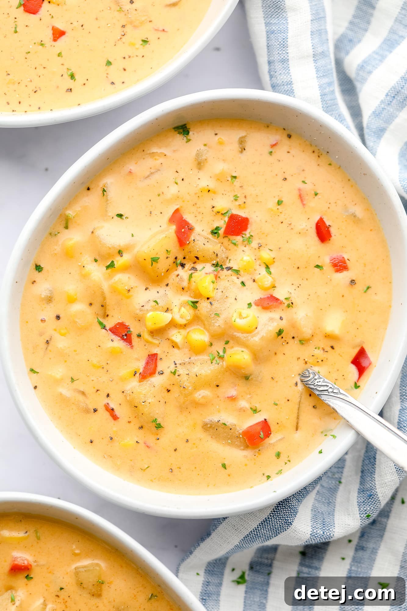 close up on a bowl of vegan corn chowder.