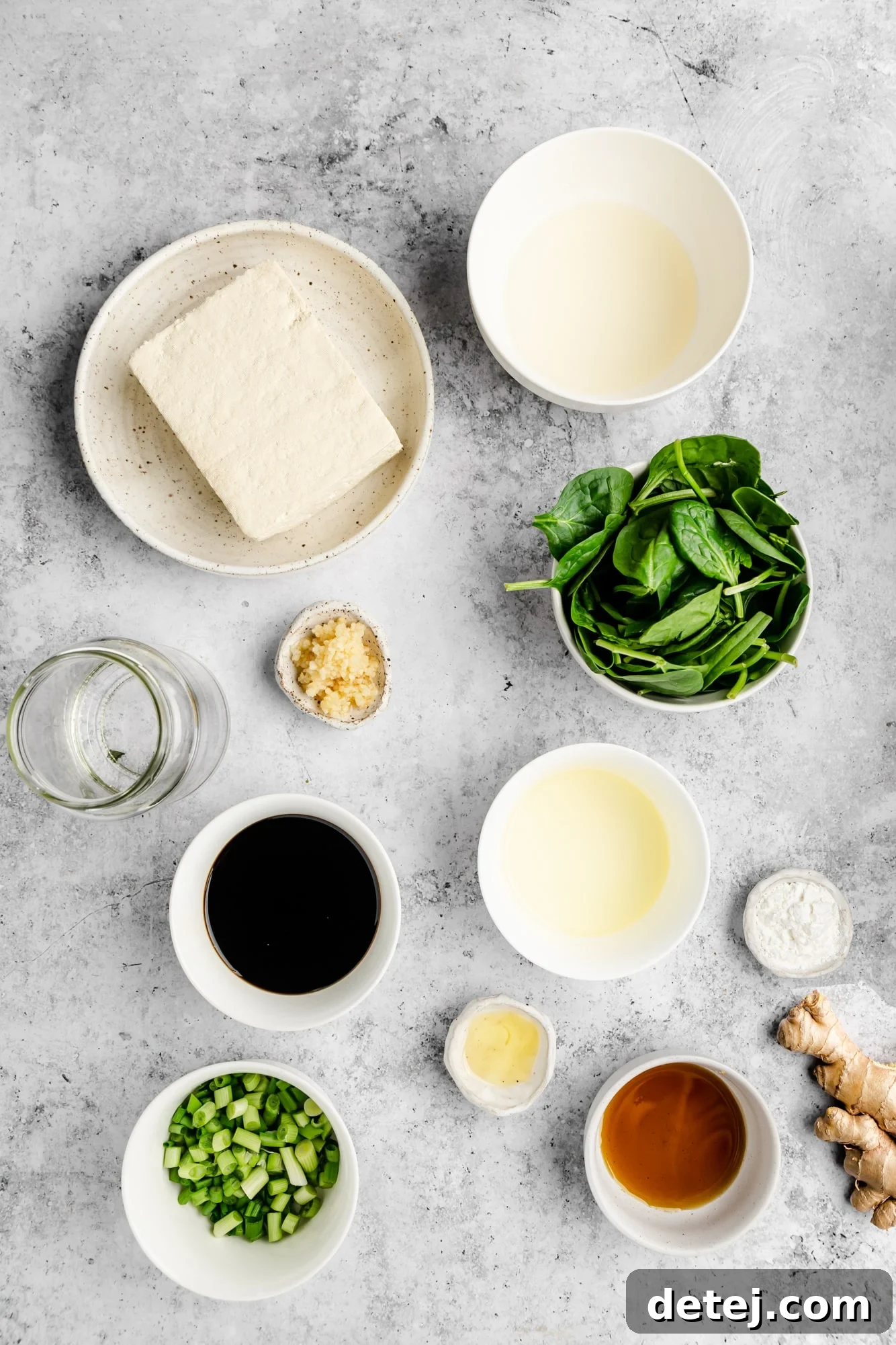 Effortless One Pan Tofu Stir Fry 3 ingredients for tofu stir fry in individual white bowls.