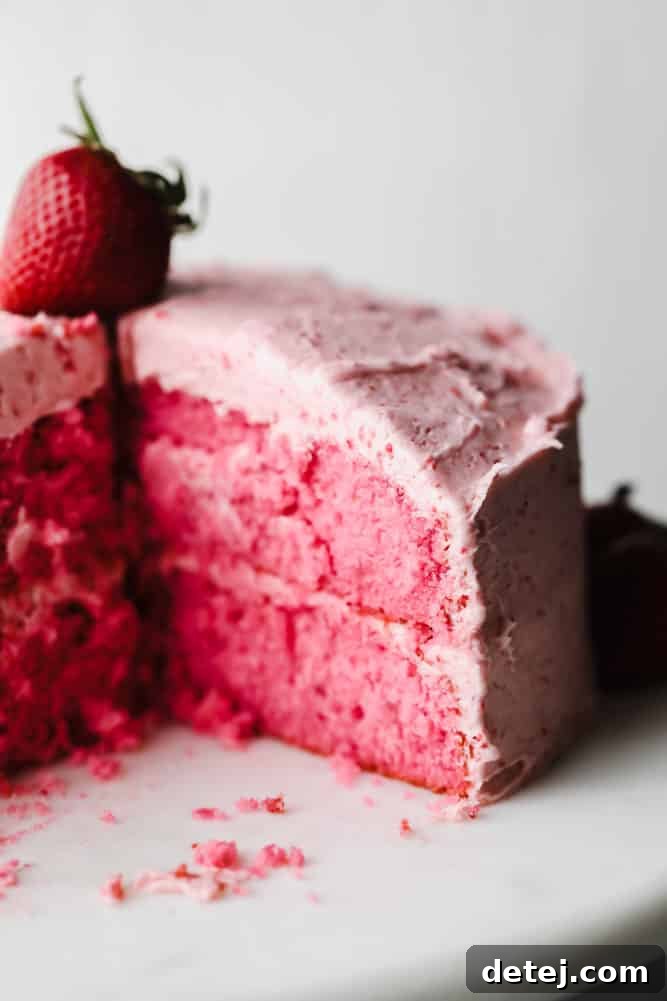 slice of cake taken out of a vegan strawberry cake