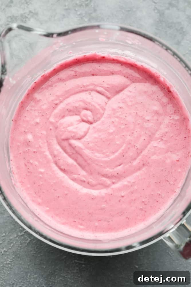 cake batter, pink, in a glass mixing bowl