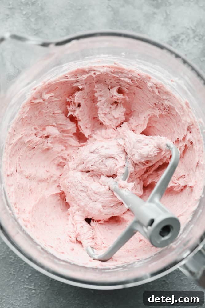 pink frosting in glass bowl