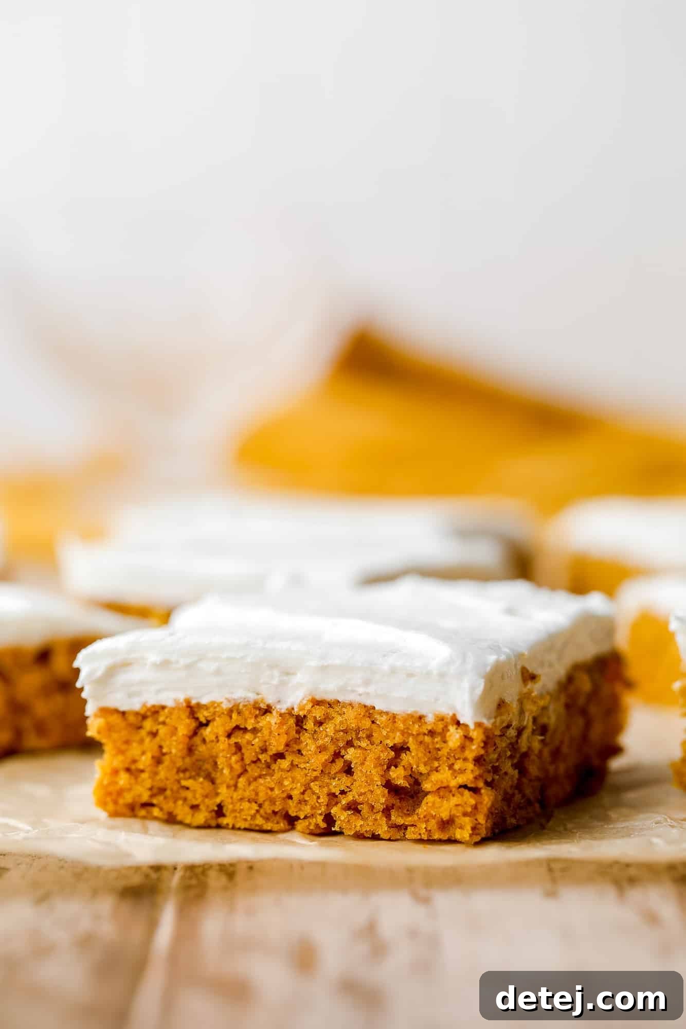 A beautifully frosted vegan pumpkin cake bar on its own, ready to be enjoyed.