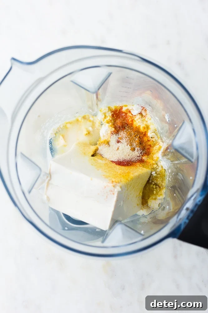 tofu and other spices in a blender before blending