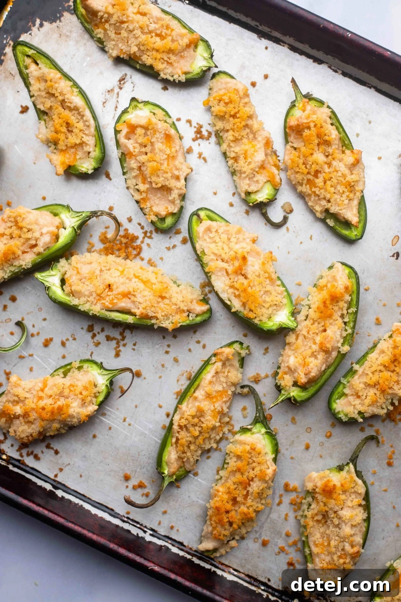 baked Vegan Jalapeno Poppers on a baking sheet.