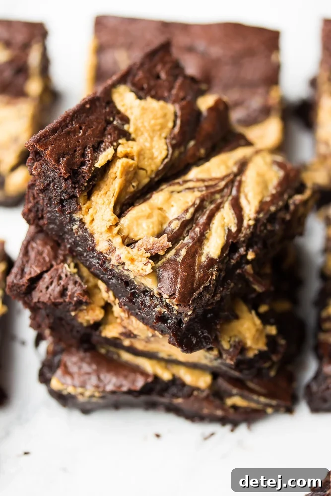 Stack of freshly baked vegan peanut butter swirl brownies