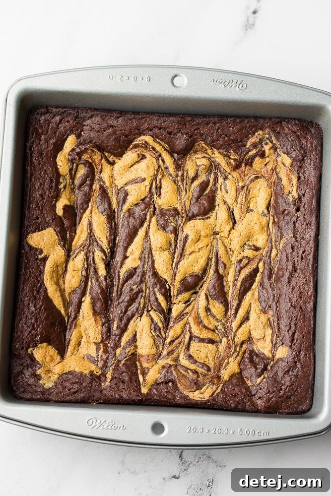 Pan of unsliced brownies after baking