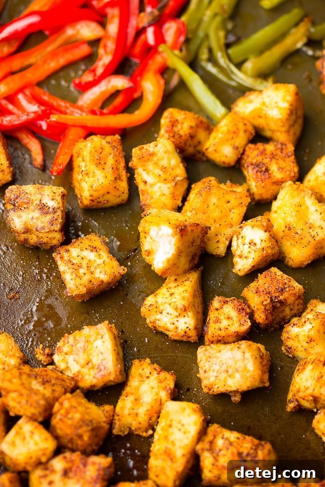 close up of tofu chikn on sheet pan with peppers