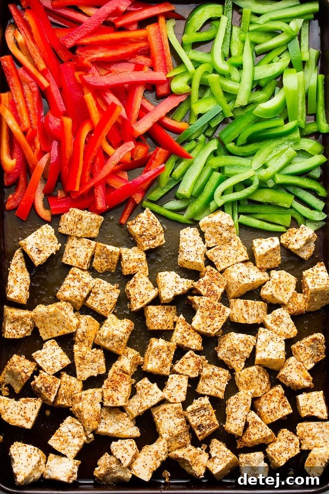 spiced tofu and peppers on sheet pan, not yet cooked
