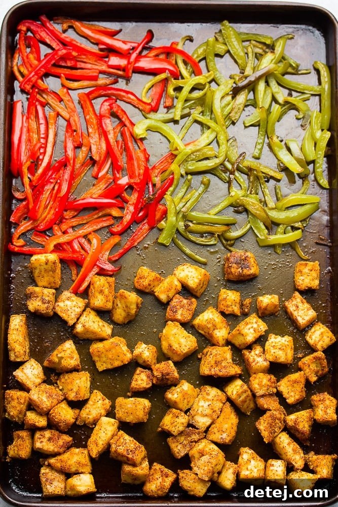 baked crispy tofu and peppers on a sheet pan