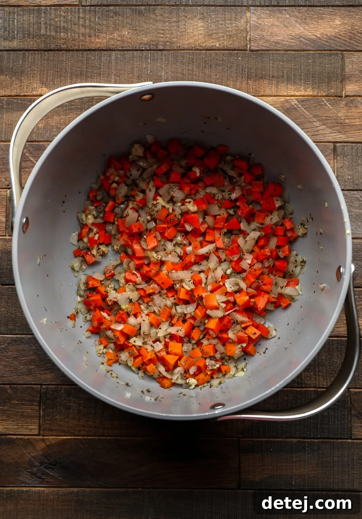 carrots and onions in a pot with spices