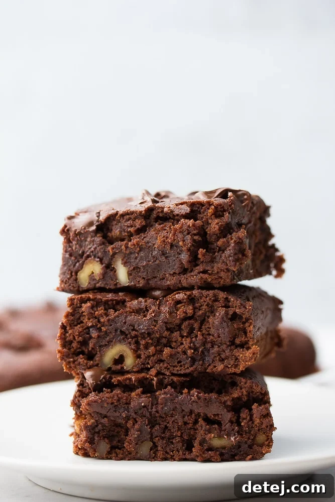 stack of brownies on gray background