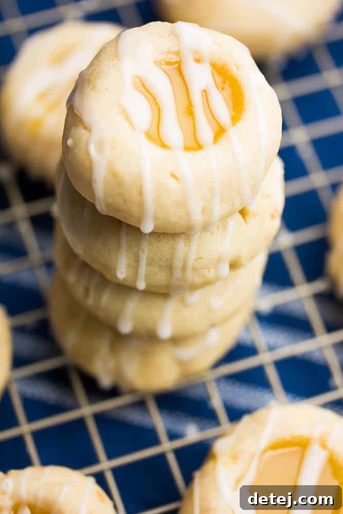 a stack of cookies on a cooling rack with a blue towel underneath