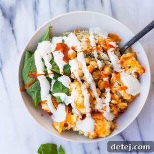 Fiery Cauliflower Harvest Bowl 5 Buffalo Cauliflower Buddha Bowl- Roasted Buffalo Cauliflower, brown rice, spinach, chickpeas and cashew cream.