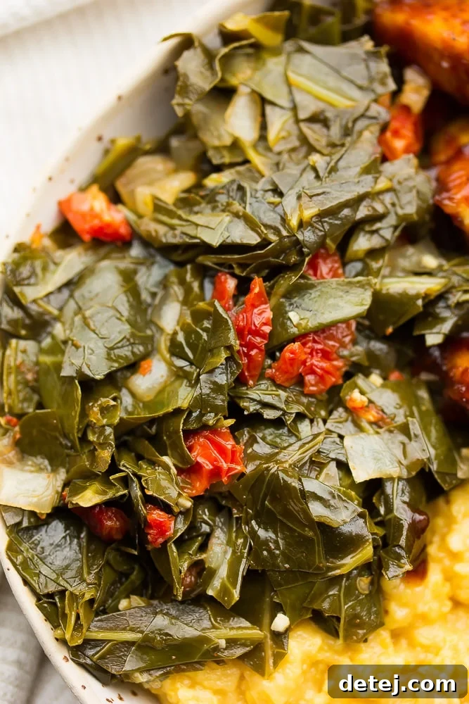 Smoky Vegan Collard Greens 2 collard greens in a bowl with grits and tofu