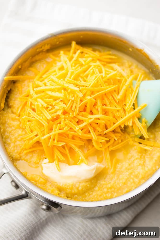 pan with grits and vegan cheese being added