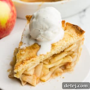 square image of apple pie with ice cream on top