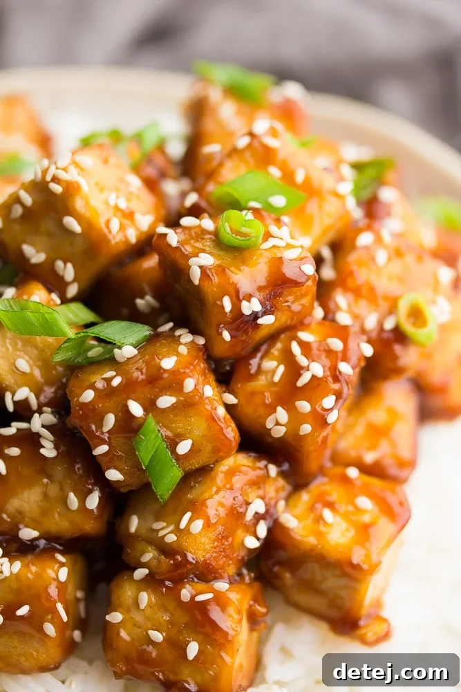 side shot close up of tofu and sauce in a bowl