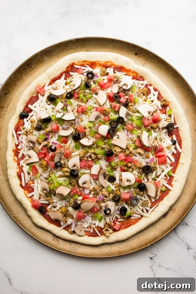 Overhead shot of uncooked pizza