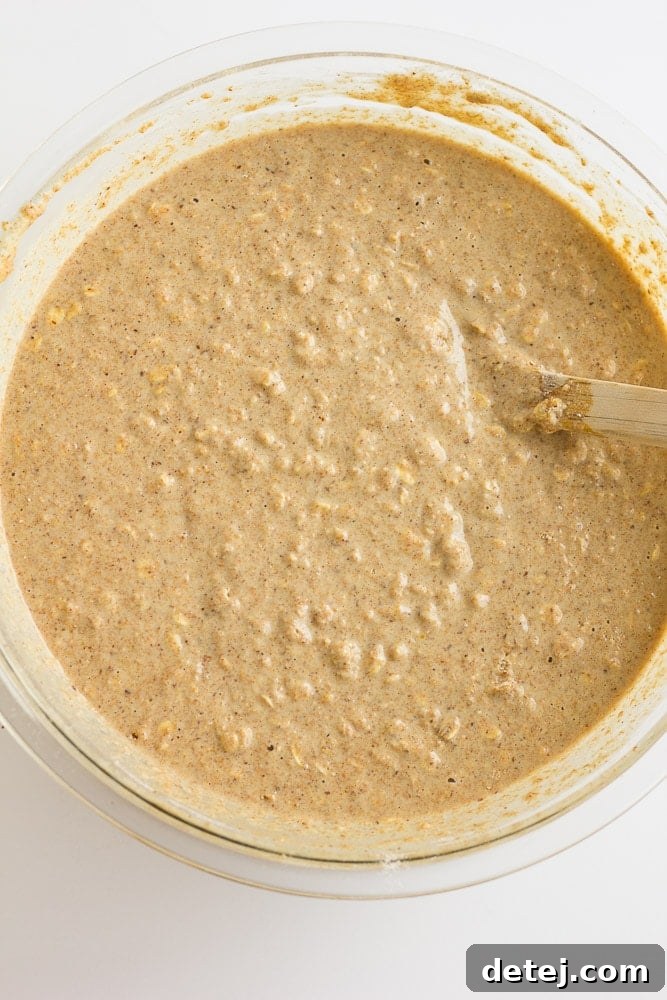 Mixing the wholesome batter for Freezer Whole Grain Pancakes before cooking.