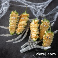 Final plated mummy jalapeno poppers with candy eyes.