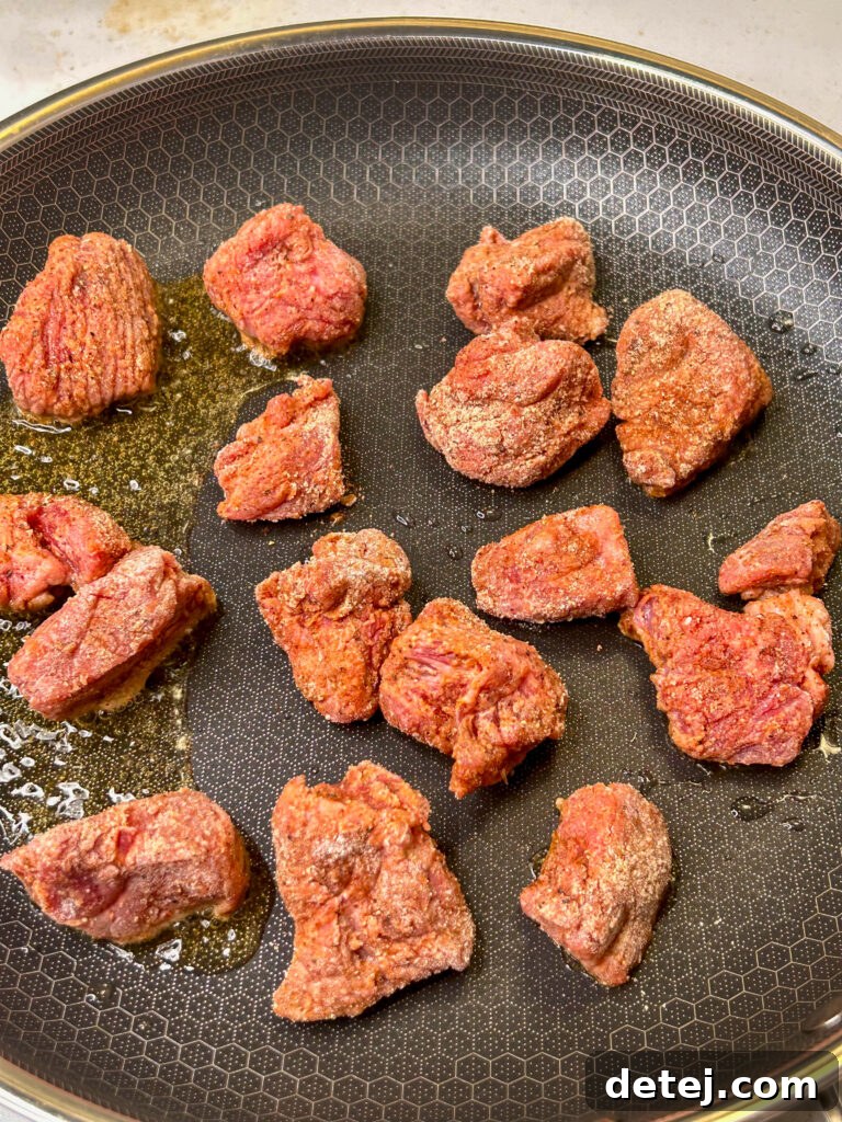 Variety of spices on a wooden board, ready for a homemade seasoning mix.