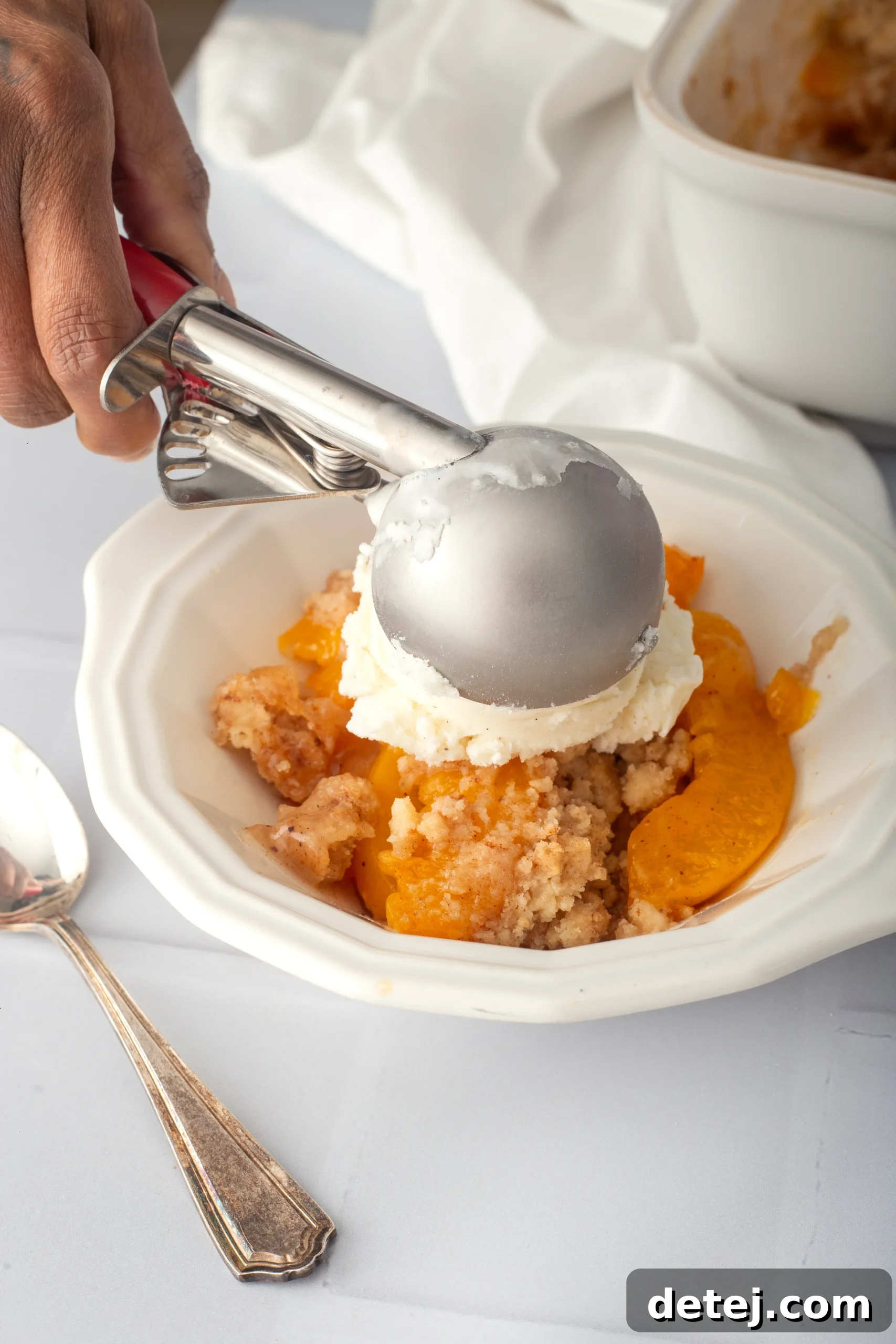 Serving Peach Cobbler with Vanilla Ice Cream