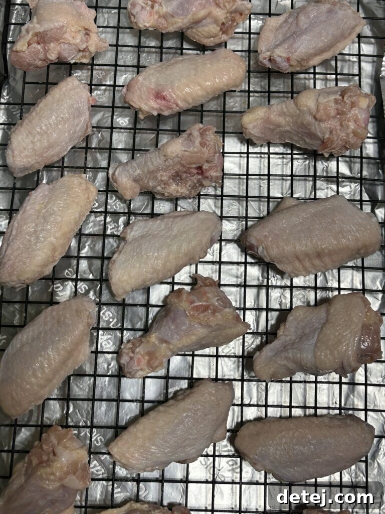 Garlic Parmesan Wings baking in the oven on a wire rack.