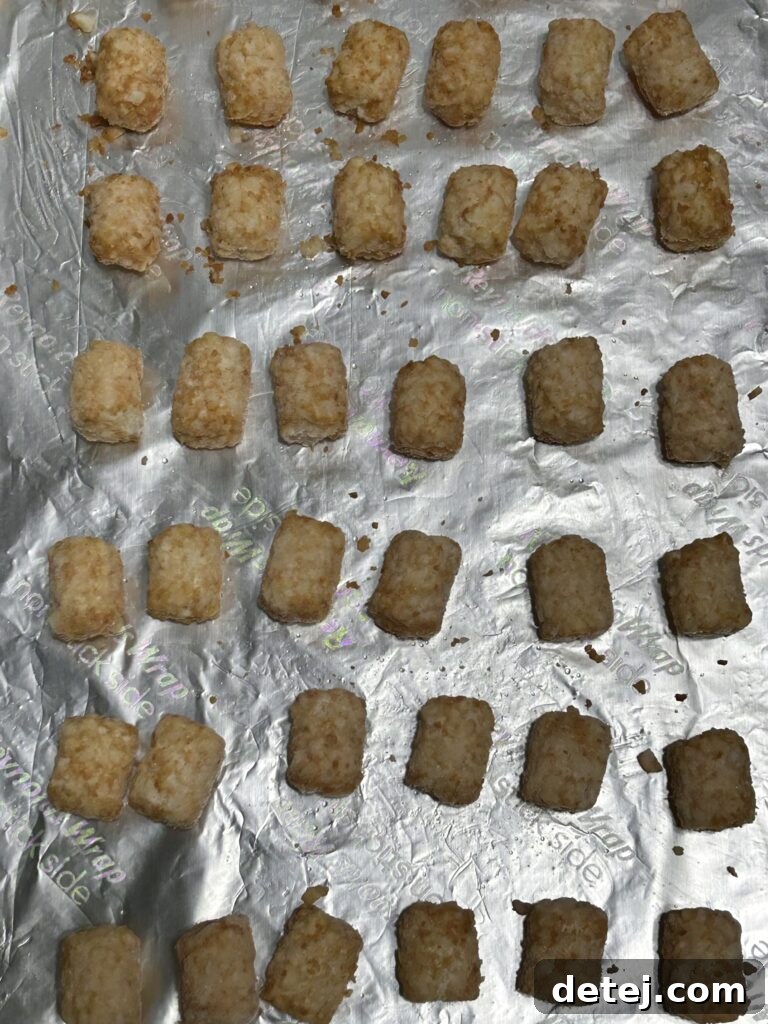 Tater tots on a baking sheet