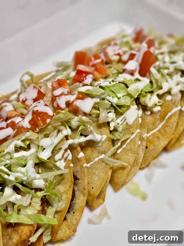 Ground beef tacos dorados frying to golden perfection