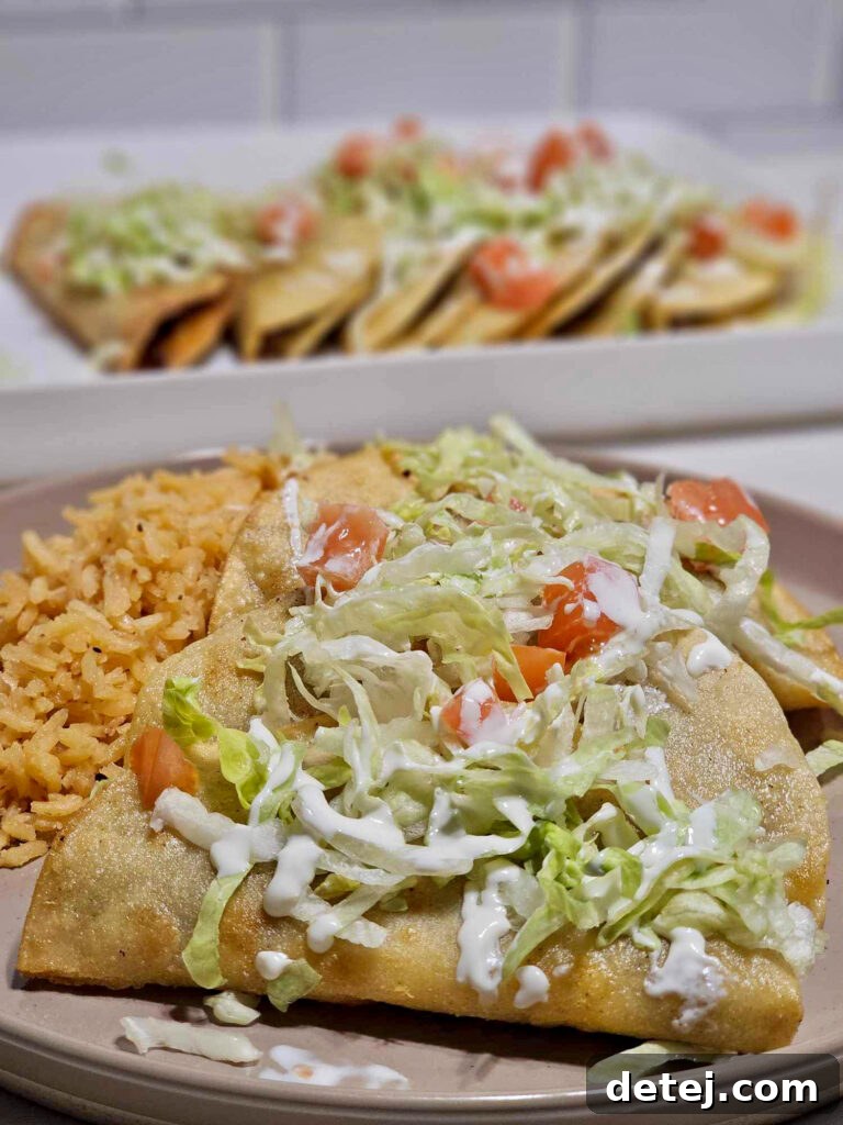 Ground beef tacos dorados on a serving platter
