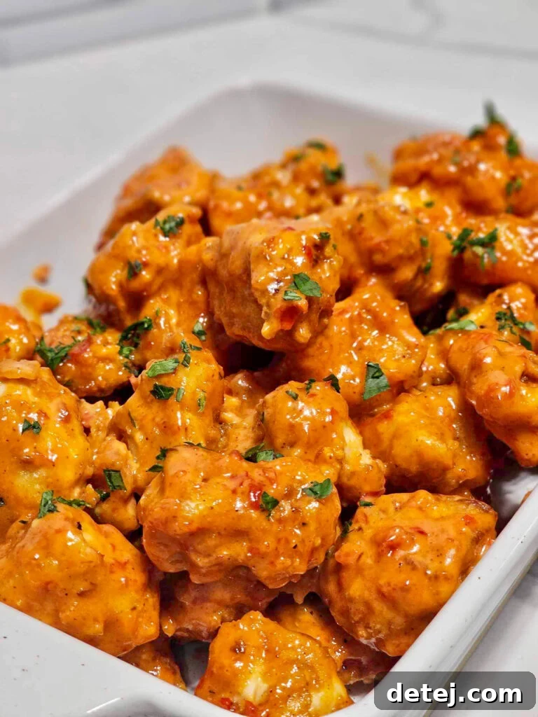 Bang Bang Chicken served with rice and green onions.