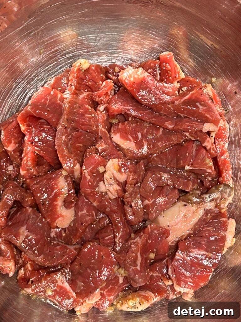 Thinly sliced sirloin steak ready for marination