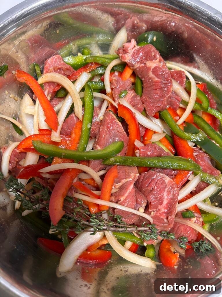 Tender strips of sirloin steak marinating in a flavorful Caribbean spice blend.