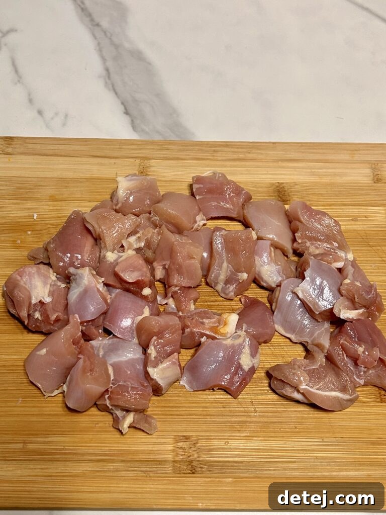 Fresh ingredients laid out for making lemon pepper chicken skewers.