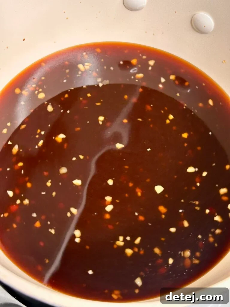 Ribeye steaks marinating in a flavorful sauce
