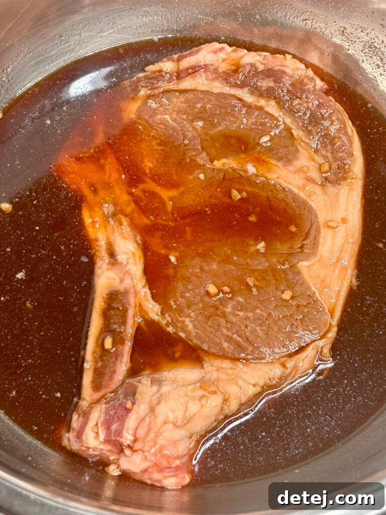 Marinated ribeye steak ready for grilling