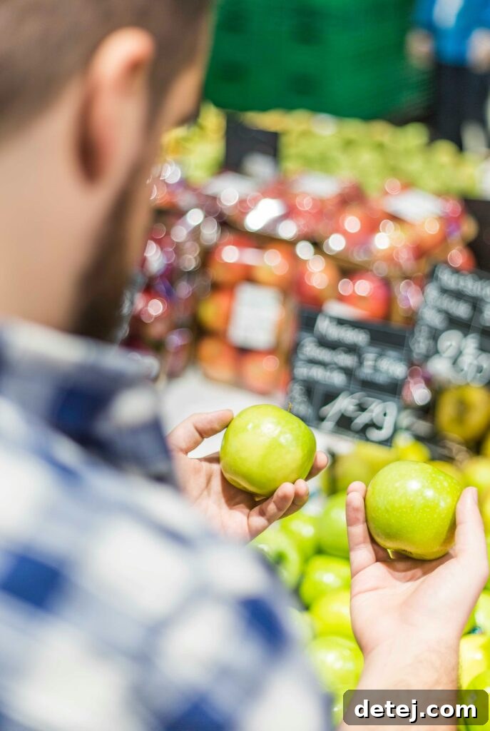 Fresh March produce, including asparagus, strawberries, spinach, and peas, ideal for spring grocery shopping.