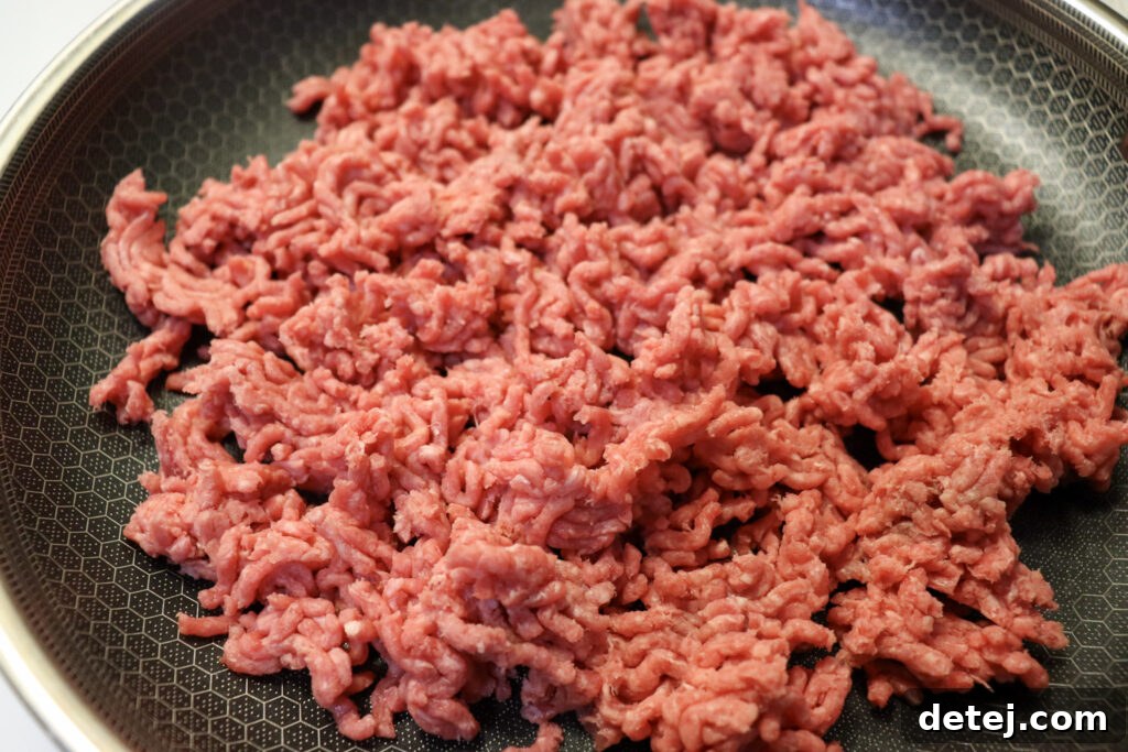 Ground beef browning in a skillet for sloppy joes