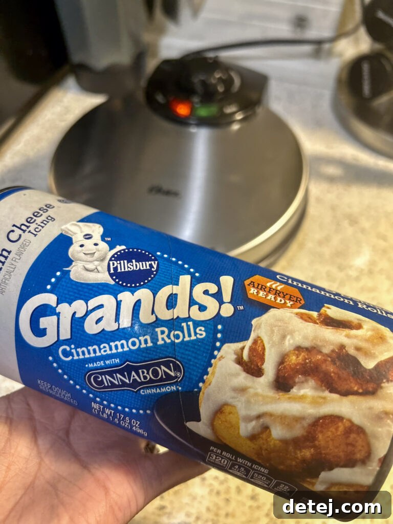 Close-up of ingredients for Cinnamon Roll Waffles, including a can of cinnamon rolls and cream cheese for icing.