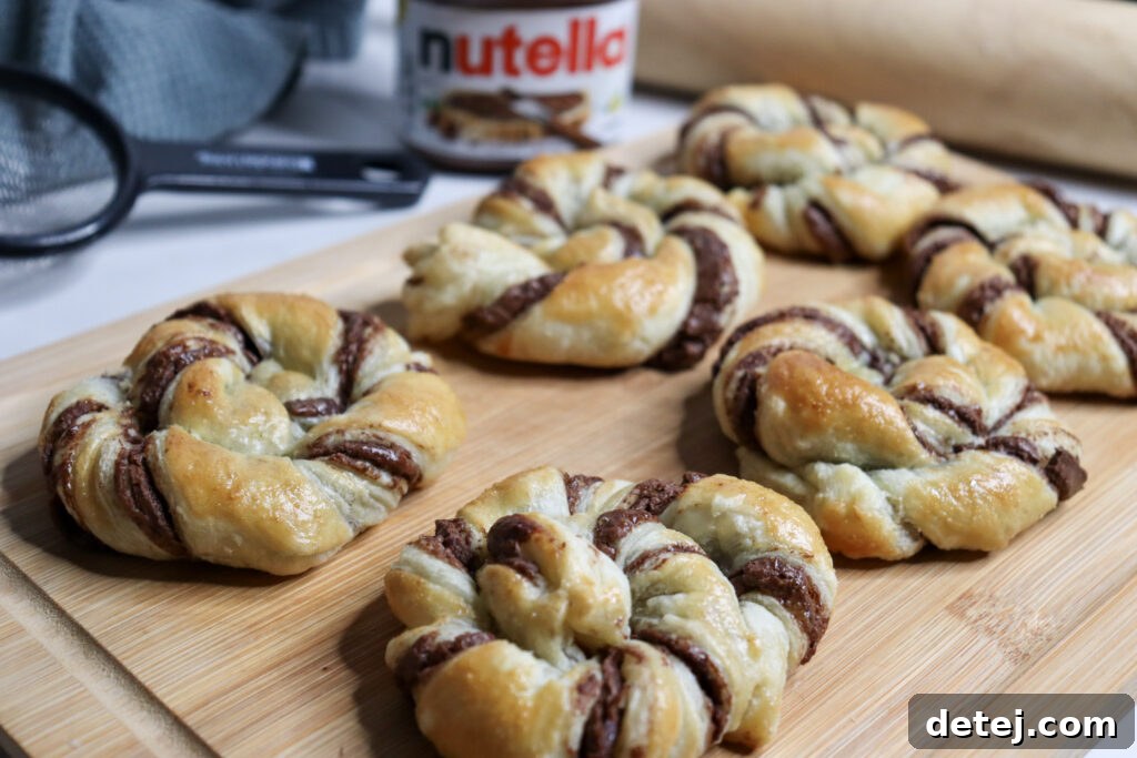 Ready-to-eat Nutella Puff Pastries dusted with powdered sugar