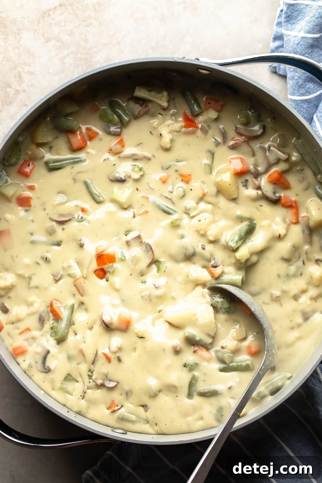 Overhead view of Creamy Vegetable Soup in a large pot, perfectly cooked and ready to be served, with a vibrant, appealing look.