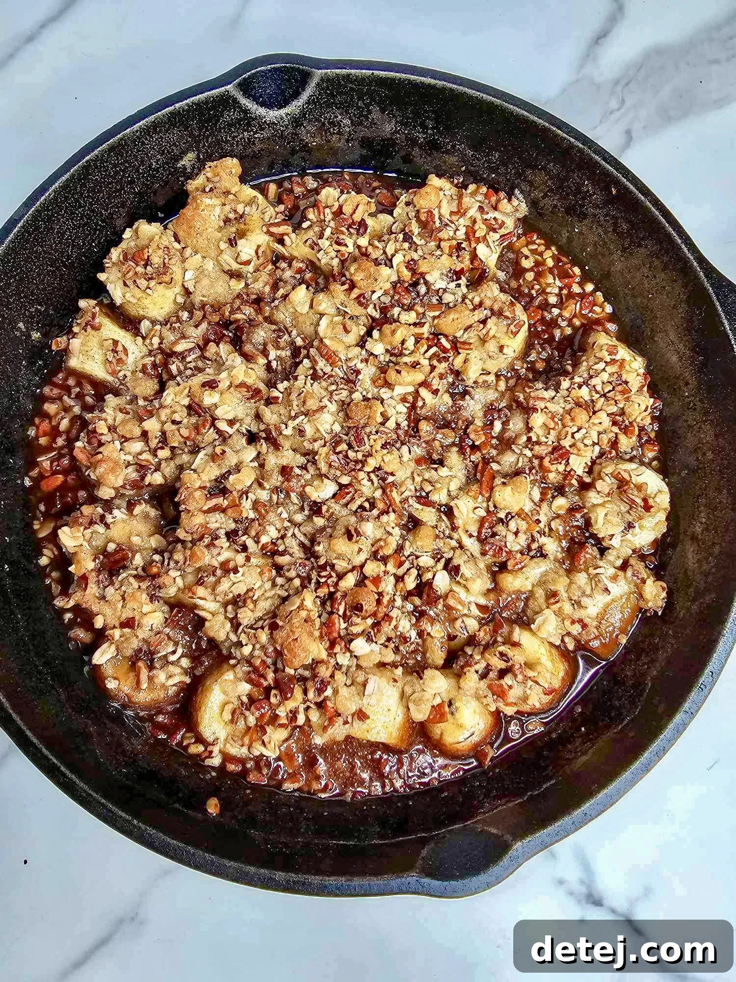 Easy Baked Banana Crumble Recipe with melting vanilla ice cream