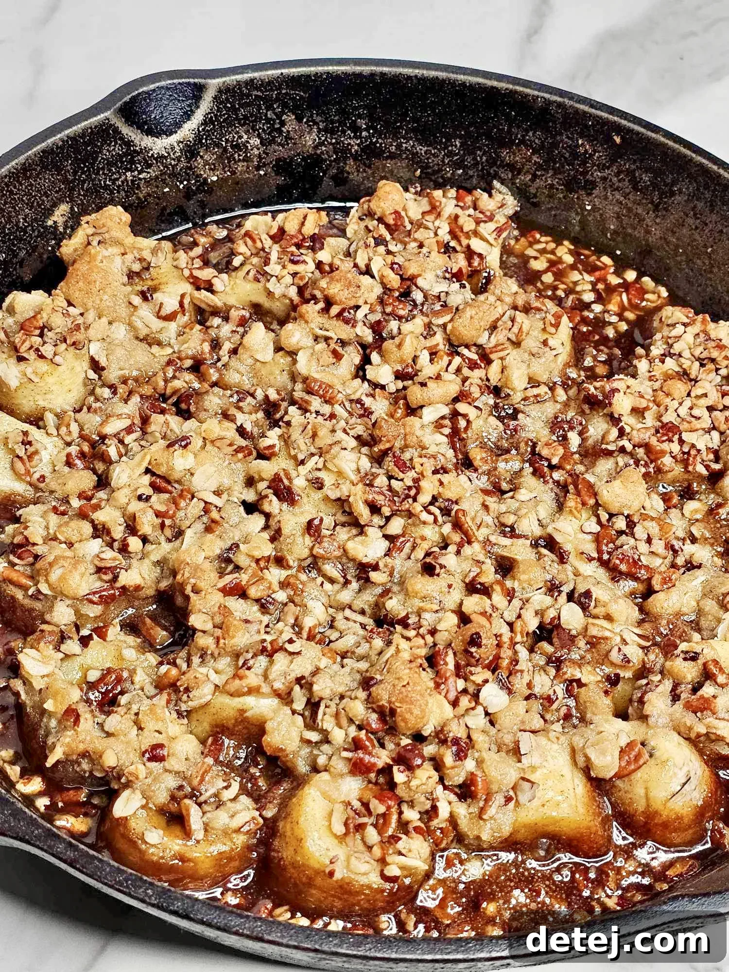Banana filling being prepared in a cast iron skillet