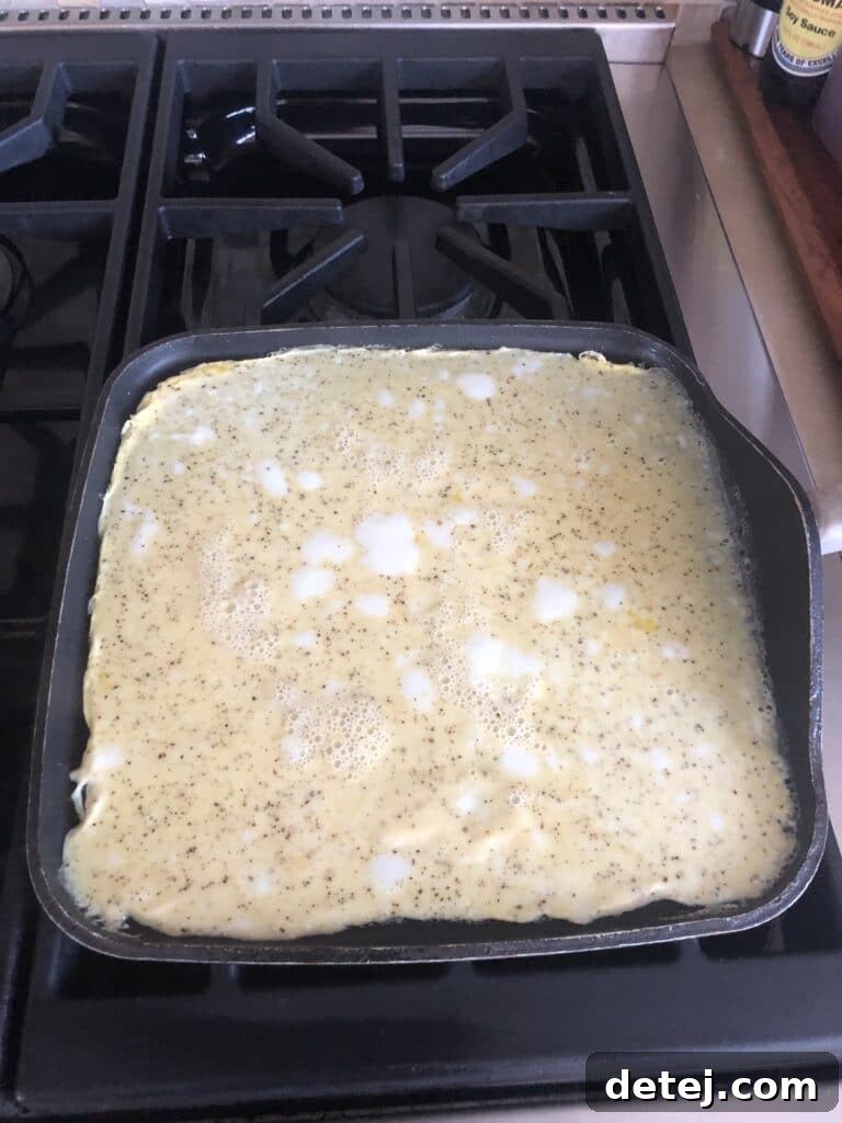 Cooked egg sheet ready to be filled for a low-carb breakfast.
