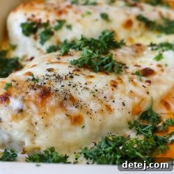 Golden baked chicken breast in a rich cashew cream sauce with melted cheese.