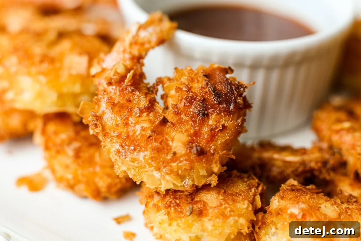 Platter of coconut shrimp with honey sriracha sauce and mango salsa