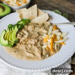 A smaller image of the creamy white chicken chili, garnished with fresh herbs.
