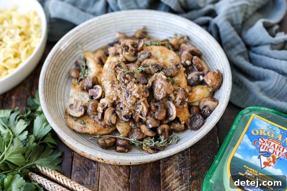 chicken marsala on a plate with packaging nearby. 